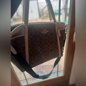 Coach Baby Bag with White Handles.